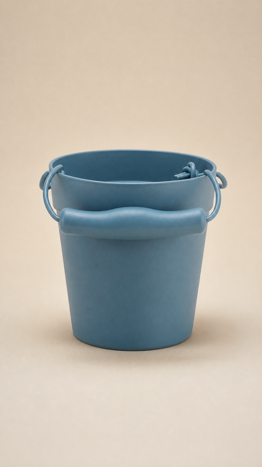 Blue bucket on a beige background